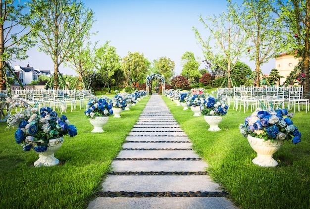 Free photo beautiful wedding flower arrangement of seats along the aisle