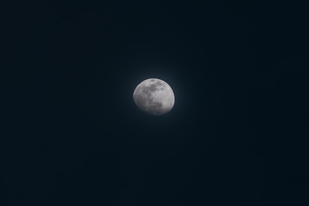 Beautiful wide shot of a full moon in a night sky