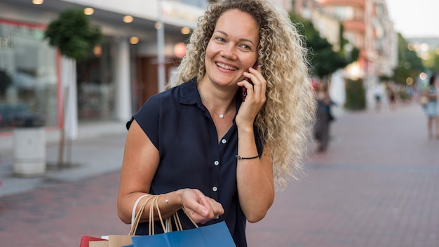 Beautiful woman carrying shopping bags