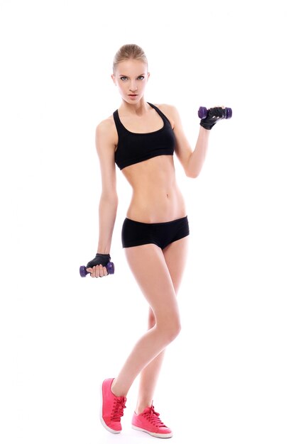 Beautiful woman doing exercises with dumbells