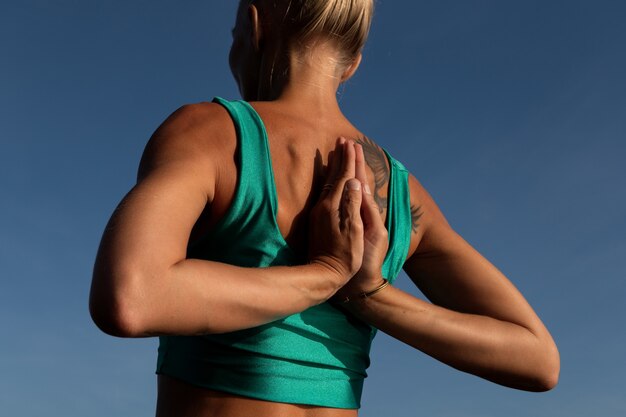 Beautiful woman doing yoga. middle plan