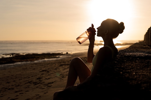 Free photo beautiful woman drinking water. bali