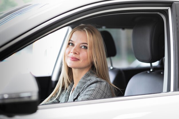 Beautiful woman driver looking at the camera