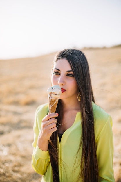 Beautiful woman eating ice cream