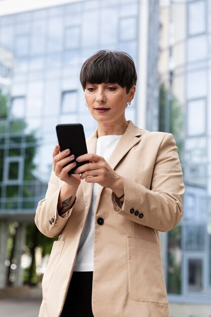 Beautiful woman in front of a glass building