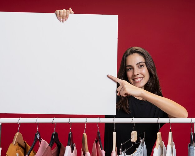 Beautiful woman holding a banner mock-up