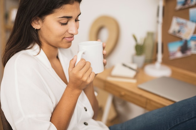 Beautiful woman holding a coffee cup