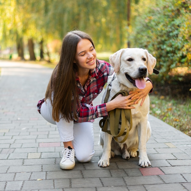 Beautiful woman holding her dog