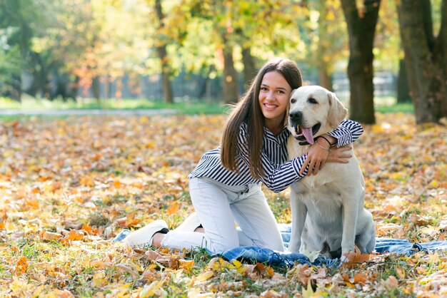 Beautiful woman holding her puppy