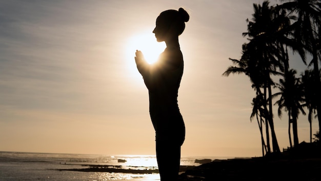 Beautiful woman meditating outdoors