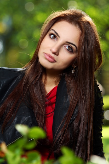 Beautiful woman in the park in a last sunny days