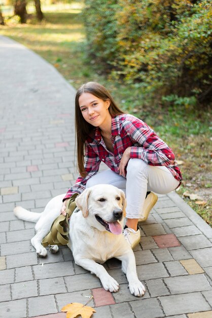 Beautiful woman petting her dog