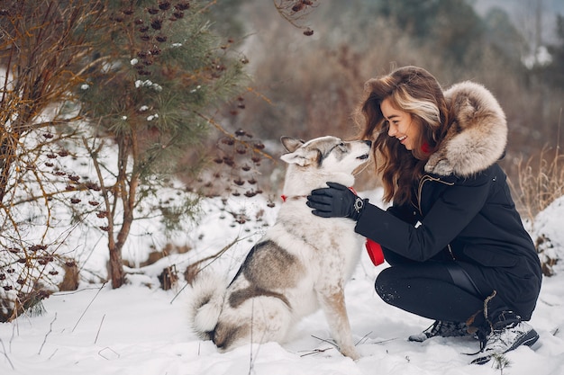 Free Photo beautiful woman playing with a dog