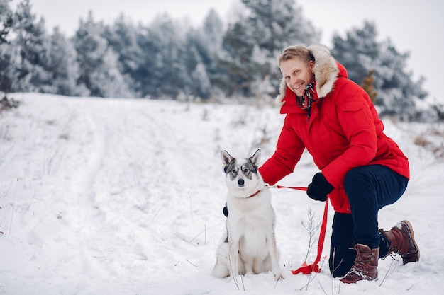 Free Photo beautiful woman playing with a dog