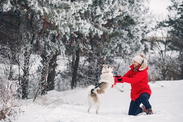 Free photo beautiful woman playing with a dog