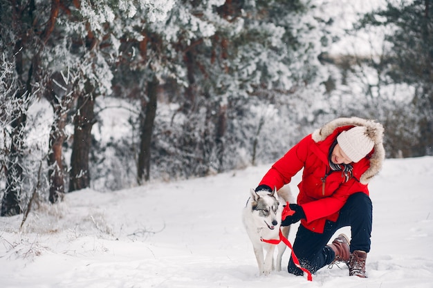 Free photo beautiful woman playing with a dog