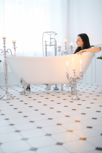 Free Photo beautiful woman posing at home in bathroom