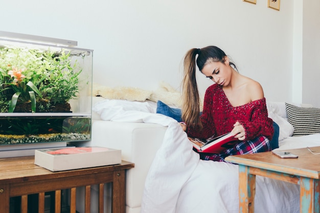 Beautiful woman reading at home