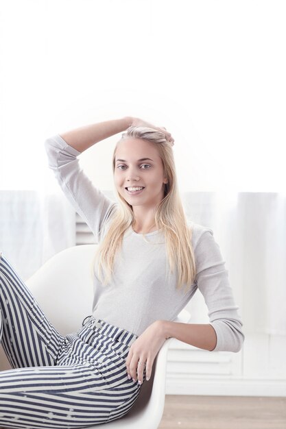 Beautiful woman sitting on a chair Beautiful girl