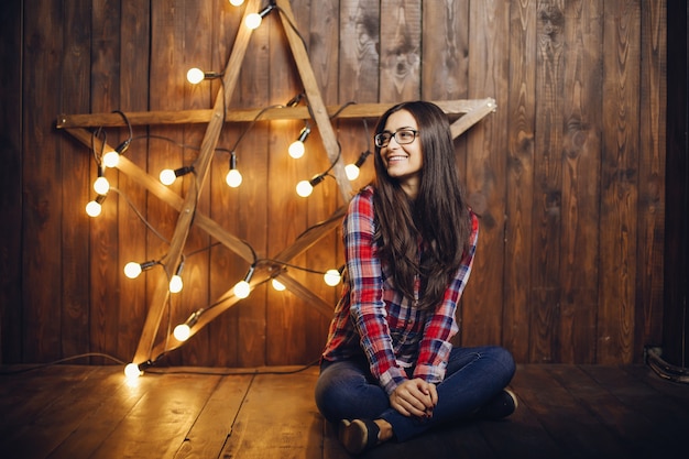 Free Photo beautiful woman sitting on a chair