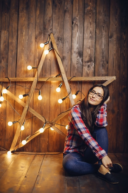 Free Photo beautiful woman sitting on a chair