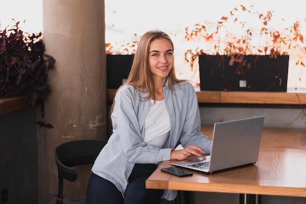 Beautiful woman sitting with a laptop