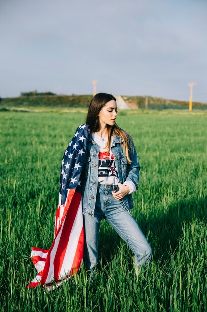 Beautiful woman staying in field