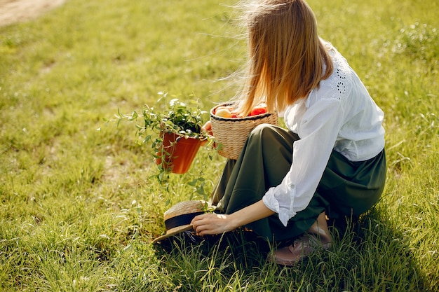 Free photo beautiful woman in a summer field