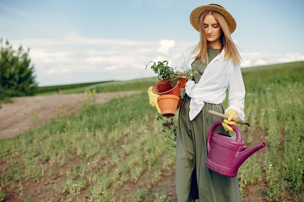 Beautiful woman in a summer field