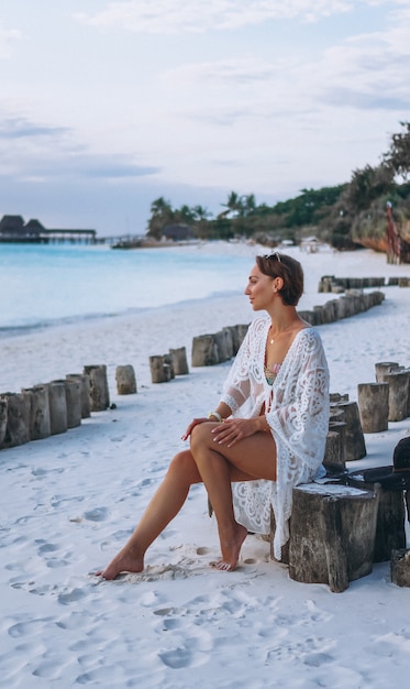 Free Photo beautiful woman in swim wear by the ocean