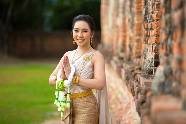 Beautiful woman in Thai old traditional costume, portrait at the ancient Ayutthaya temple