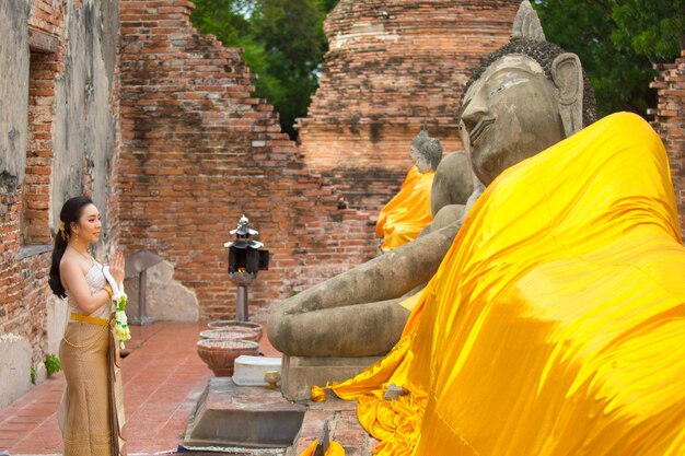 Beautiful woman in Thai old traditional costume , portrait at the ancient Ayutthaya temple.