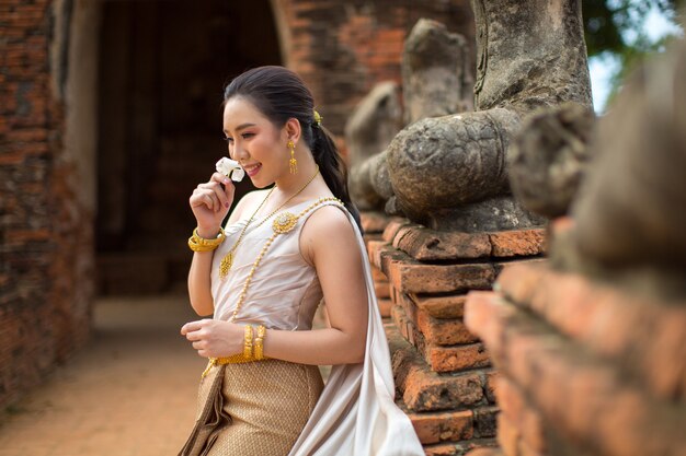 Beautiful woman in Thai old traditional costume , portrait at the ancient Ayutthaya temple.