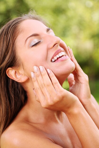 Beautiful woman washing her face