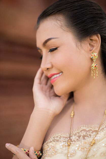 Beautiful Woman wearing typical Thai dress