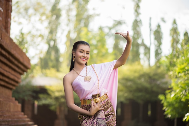 Beautiful Woman wearing typical Thai dress