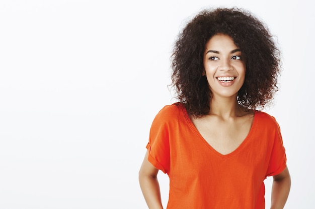 Beautiful woman with afro hairstyle posing in the studio