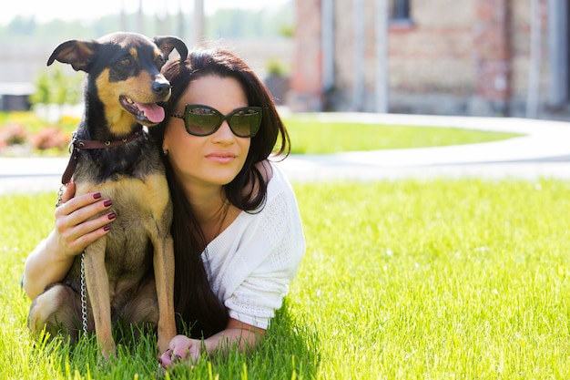 Free Photo beautiful woman with dog