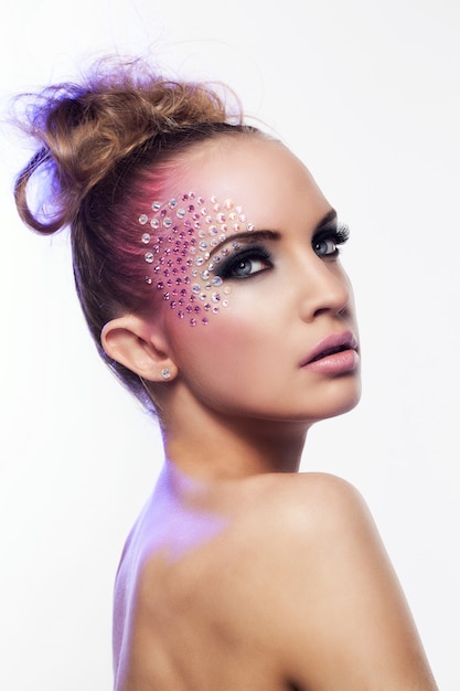 Free photo beautiful woman with fantasy makeup