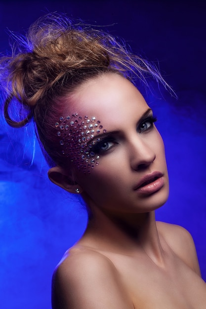 Free Photo beautiful woman with fantasy makeup