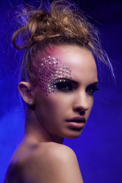 Free Photo beautiful woman with fantasy makeup