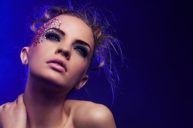 Free Photo beautiful woman with fantasy makeup