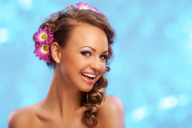 Free Photo beautiful woman with flowers in her hair