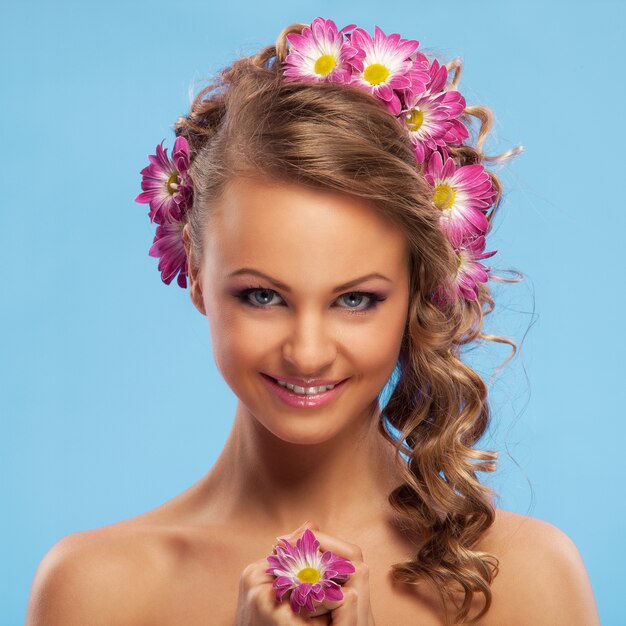 Beautiful woman with flowers in her hair