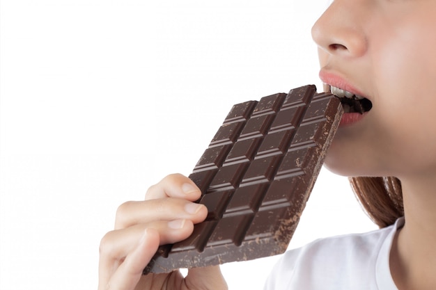 Beautiful woman with a happy smile holding a hand chocolate