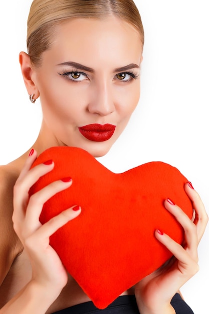 Free Photo beautiful woman with a heart indoor isolated