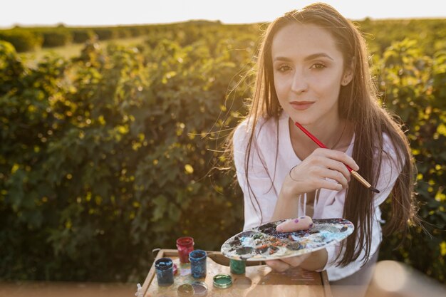 Beautiful woman with painting elements