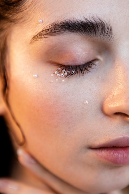 Free photo beautiful woman with pearls make up