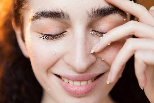 Free photo beautiful woman with pearls make up