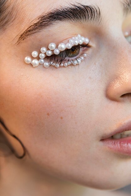 Beautiful woman with pearls make up